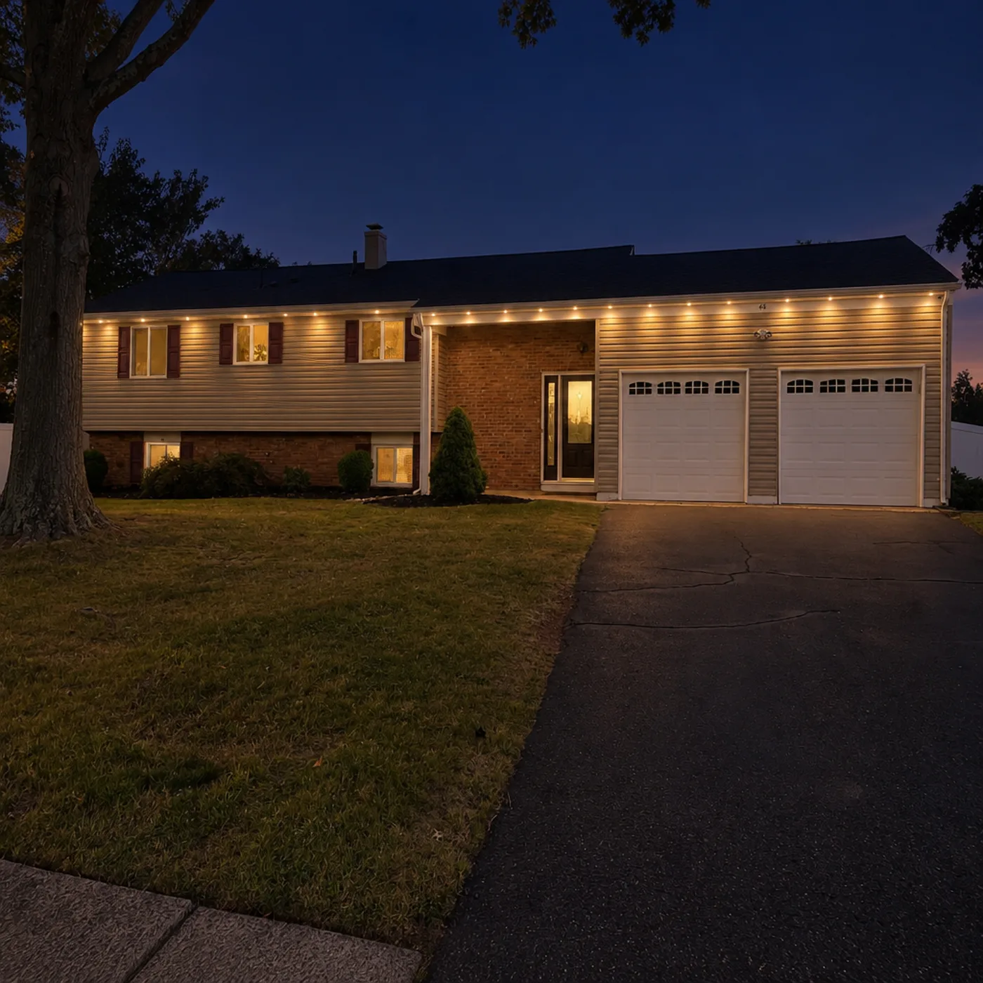 The same house at dusk with permanent roofline lighting, preview generated from the customer's photo